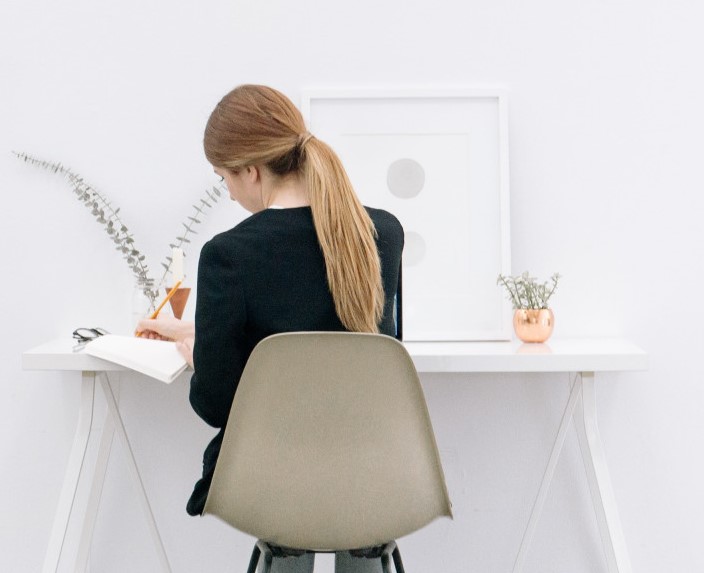 A girl working at the table.